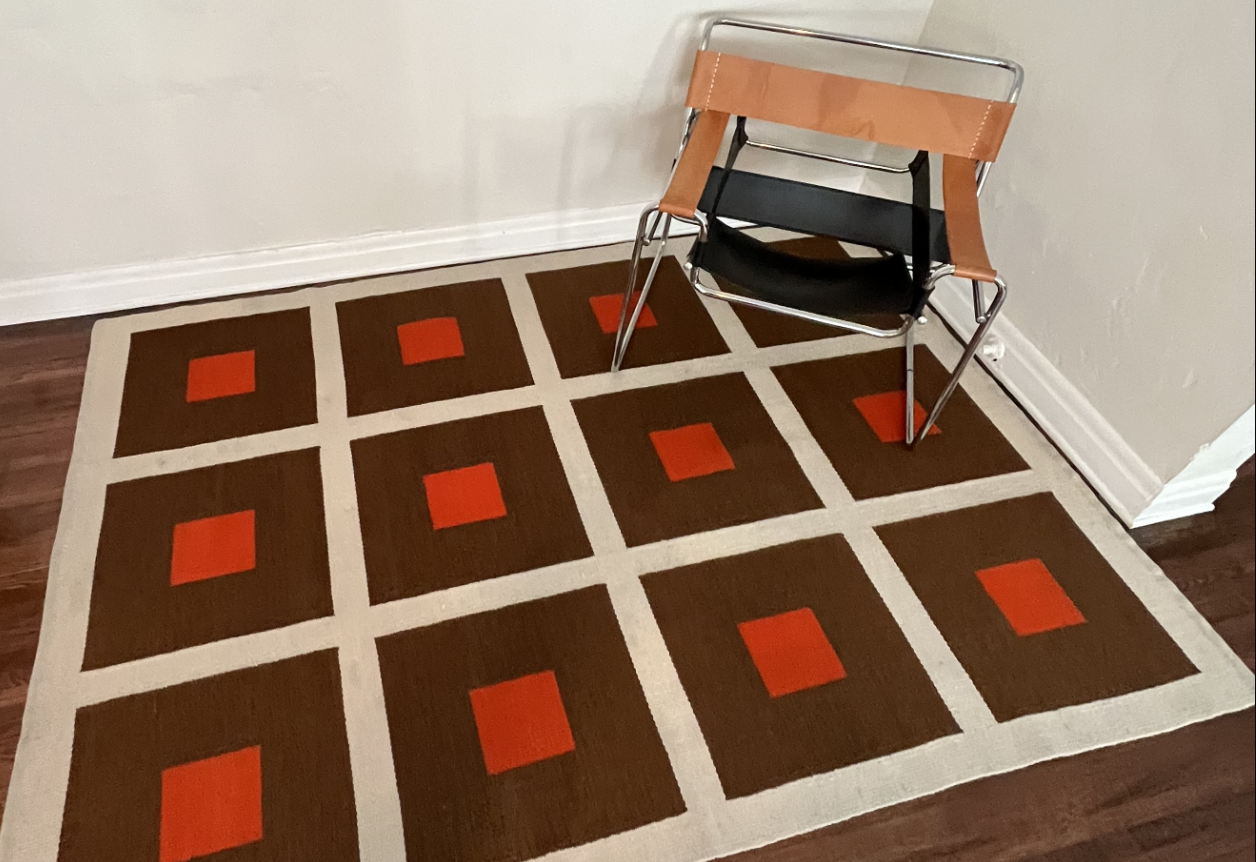 geometric rug and wassily chair on hardwood floors