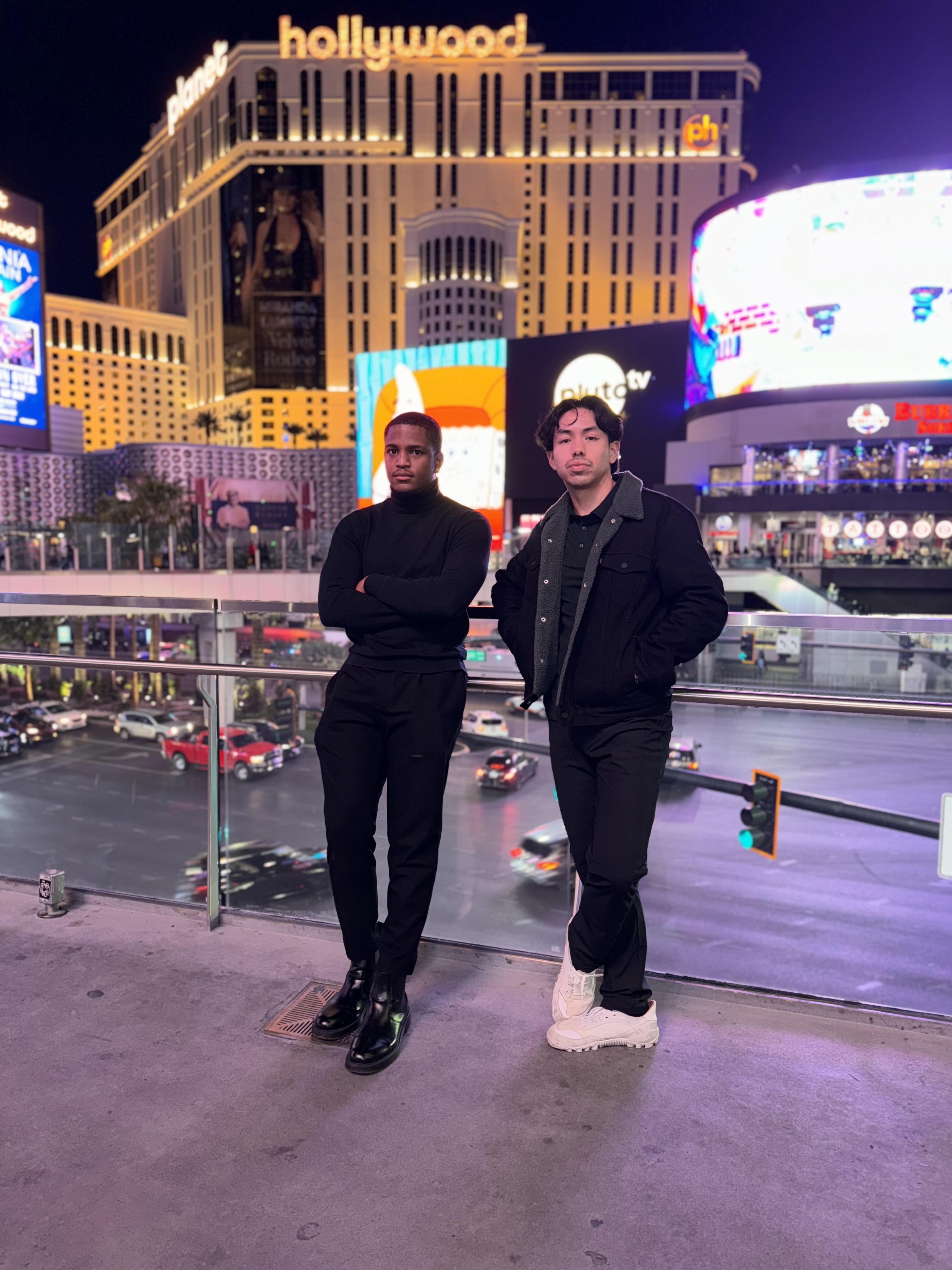 two guys on the las vegas strip at night